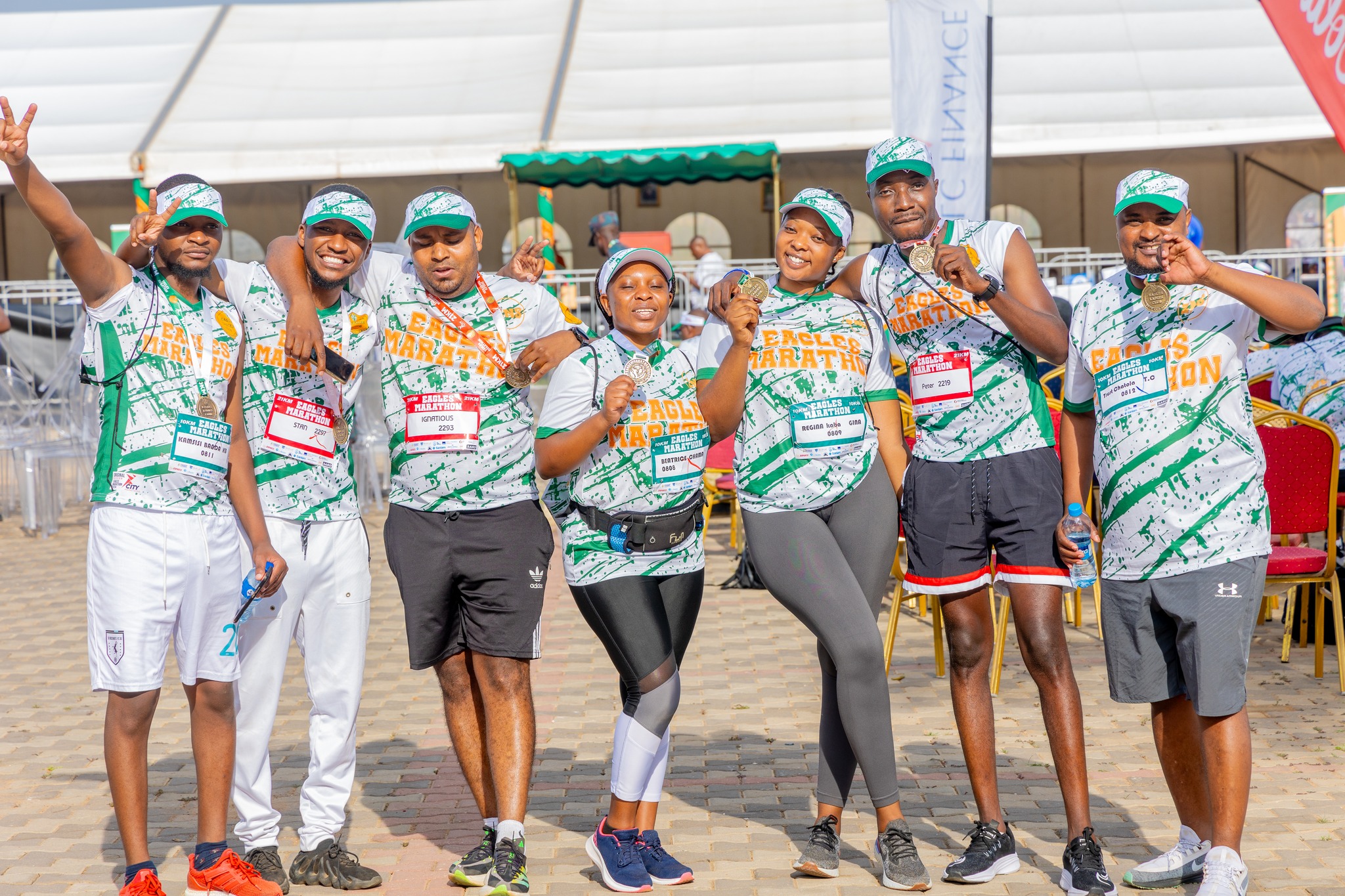 Marathon group of runners with race bibs on the road